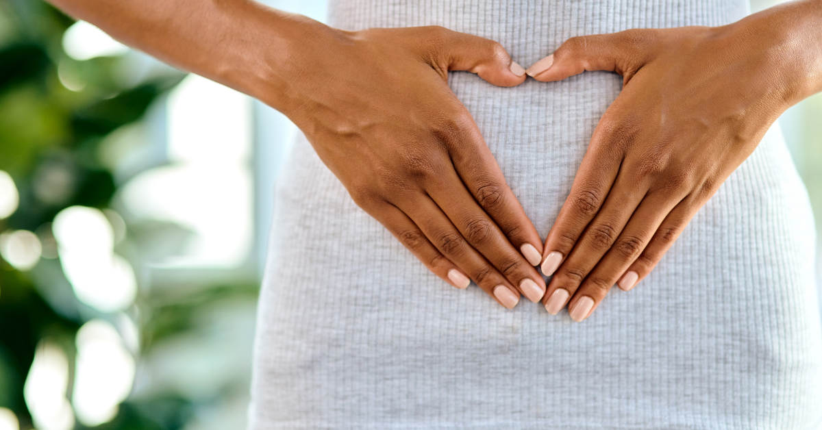 woman holding stomach for gut health